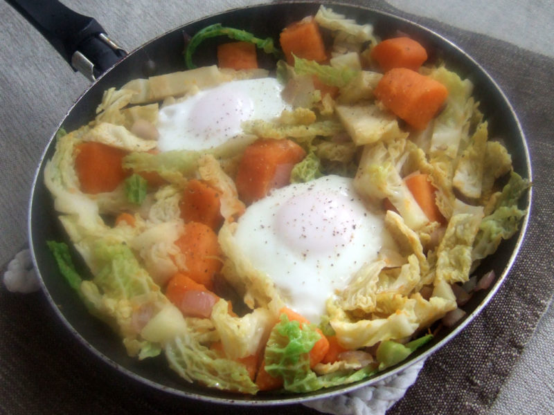 Sauteed sweet potatoes and cabbage with fried eggs